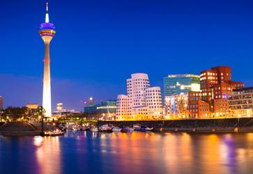Colorful night scene of Rhein river at night in Dusseldorf. Photo: Getty Images/iStockphoto